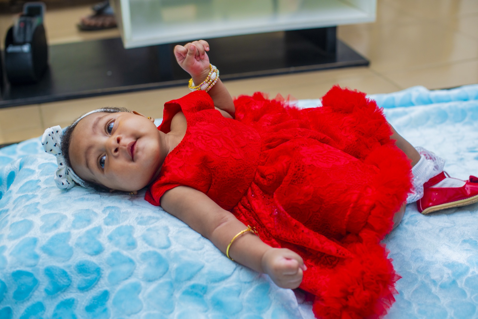 Ramona smiling in her red lace dress